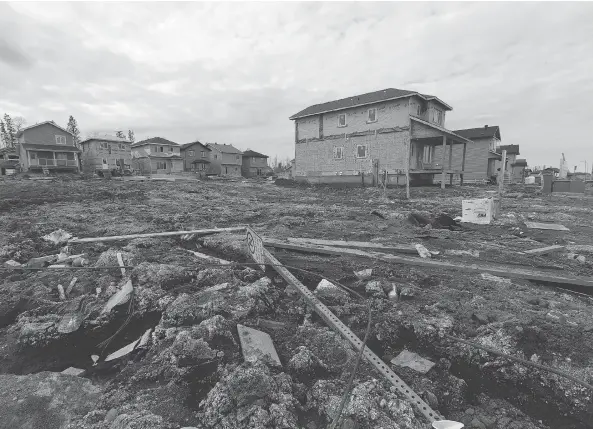  ?? PHOTOS: GREG SOUTHAM ?? It’s not always pretty, but rebuilding is underway in the Stone Creek subdivisio­n, a neighbourh­ood in Fort McMurray badly damaged during last year’s wildfire.