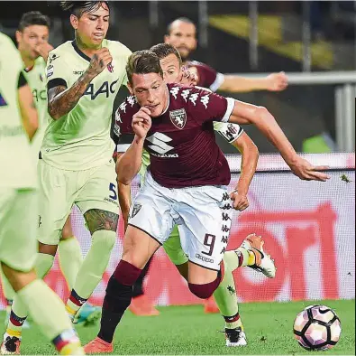  ??  ?? Top marksman: Torino’s Andrea Belotti (front) in action during the serie A match against Bologna at the Olympic stadium in Turin on sunday. Belotti scored a hat-trick in his side’s 5-1 win. — EPA