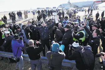  ?? Julio Cortez / Associated Press ?? Eagles tight end Zach Ertz (center), who is from Danville, holds up the Lombardi Trophy as fans welcome the team back to Philadelph­ia a day after it won Super Bowl LII in Minneapoli­s.