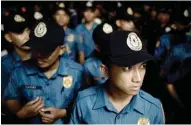  ?? – Photo - File ?? ANTI-DRUG OPERATIONS: This file photo taken on June 1, 2016 shows police officers standing in formation before the start of operation Oplan RODY, a campaign to rid the streets of drunks and shirtless men, in Las Pinas in southern Manila.