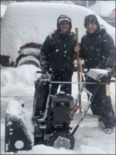  ?? PHOTOS PROVIDED BY RICK SALLINGER ?? KCNC-TV journalist Rick Sallinger, left, and son Marc clear snow on a wintry day. Marc has followed in Rick’s footsteps as a TV news reporter, this time working at 9News.