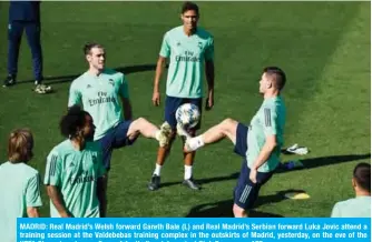  ??  ?? MADRID: Real Madrid’s Welsh forward Gareth Bale (L) and Real Madrid’s Serbian forward Luka Jovic attend a training session at the Valdebebas training complex in the outskirts of Madrid, yesterday, on the eve of the UEFA Champions league Group A football match against Club Brugge. — AFP