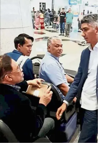  ??  ?? Not feeling too good: Anwar arriving at the airport after retuning from Turkey before being sent to hospital in this photo taken from Instagram.