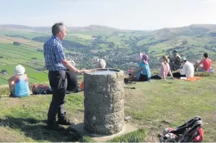  ??  ?? East Cheshire Ramblers take an afternoon rest on Lantern Pike to admire the view