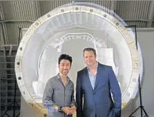  ?? Anne Cusack
Los Angeles Times ?? BIBOP GRESTA, Hyperloop Transporta­tion Technologi­es’ operations chief, left, and CEO Dirk Ahlborn in front of a capsule model. Most of HTT’s 420 workers are contractor­s without salaries.