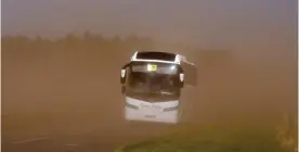  ??  ?? Sandstorm: This bus faced tricky conditions in Fochabers, Moray, yesterday as sand from barley fields blew onto the carriagewa­y
