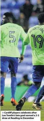  ??  ?? > Cardiff players celebrate after Lee Tomlin’s late goal earned a 2-2 draw at Reading in December