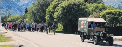  ?? PHOTO: JOHN TAYLOR ?? Community spirit . . . About 300 people joined a parade, led by a World War 1 ambulance, from Lake Hawea’s Peter Fraser Park to the Anzac Peninsula Memorial.