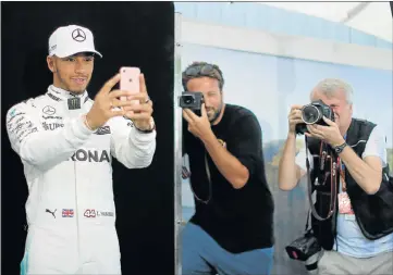  ?? Picture: REUTERS ?? SAY CHEESE: Mercedes driver Lewis Hamilton of Britain takes a selfie during the driver portrait session at the first race of the year