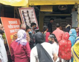  ?? ?? FAIR PRICE SHOP in Bhopal, August 2021. The Take Home Ration scheme targets out-of-school adolescent girls.