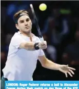  ??  ?? LONDON: Roger Federer returns a ball to Alexander Zverev during their match on day three of the ATP Finals at the O2 Arena in London. — AP