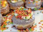  ?? DANA JENSEN/THE DAY ?? The Fruity doughnut is dipped in a sweet-milk glaze and topped with bright-colored cereal.
