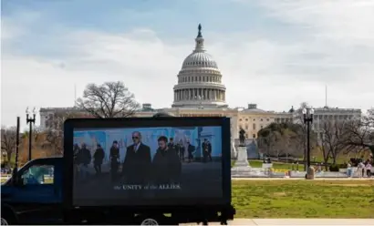  ?? TASOS KATOPODIS/GETTY IMAGES FOR VOTEVETS ?? A VoteVets electronic billboard outside the US Capitol calls for passage of aid bill for Ukraine on March 13.