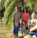  ??  ?? From left: Blue Moon awaits a rising tide in the Abacos to get off the beach. Brian and Abby attend a picnic with the kids. Shannon, who’d never sailed before, joins Jon in the cockpit.