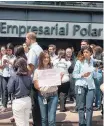  ?? MIGUEL GUTIÉRREZ/EFE ?? Ato. Empregados do grupo Polar protestam em Caracas