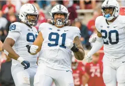  ?? DOUG MCSCHOOLER/AP ?? Penn State defensive tackle Dvon Ellies (91) reacts Saturday after sacking Indiana quarterbac­k Jack Tuttle. Tuttle was injured on the play.