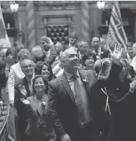  ?? CHAD HIPOLITO / THE CANADIAN PRESS ?? B.C. NDP leader John Horgan waves to supporters in the legislativ­e gallery following a swearing-in ceremony at Legislatur­e in Victoria, B.C. last Thursday.