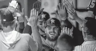  ?? Brian Davidson / Getty Images ?? The Astros’ Max Stassi celebrates his three-run homer against the Royals on Saturday. Alex Bregman also joined Stassi in hitting a three-run shot.