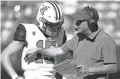  ?? CHRISTIAN PETERSEN/GETTY IMAGES ?? Arizona coach Jedd Fisch talks with Will Plummer on the sideline during the first half Saturday against Utah in Tucson.