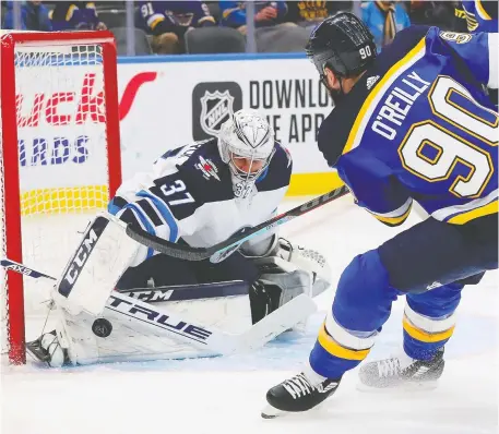  ?? DILIP VISHWANAT/GETTY IMAGES ?? The Winnipeg Jets can challenge for the Stanley Cup if goalie Connor Hellebuyck keeps up his Vezina-worthy play. Despite the team’s suspect defence, Michael Traikos writes, the Jets probably have the best chance of all the Canadian teams to go on a long playoff run.