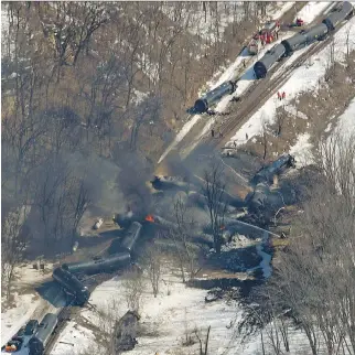  ?? MI K E B U R L E Y, T E L E G R A P H H E R A L D / T H E A S S O C I AT E D P R E S S ?? Railcars burn at the scene of a freight train derailment south of Galena, Ill., on March 6. In view of recent derailment­s, BNSF will increase track inspection­s.