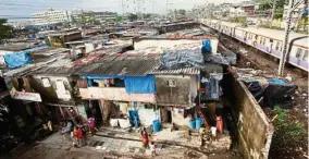  ??  ?? Slums are often the only affordable housing available for migrants to Indian cities. — Photos: Filepic