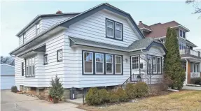  ??  ?? From the outside, the home looks like a typical turn-of-the-century bungalow.