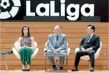  ?? — AFP ?? La Liga ambassador Carolina Marin, president of La Liga Javier Tebas and deputy chairman of Fifa’s disciplina­ry committee Kim Kia Tong attend the official launch of the La Liga office in Singapore on Thursday.