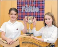  ??  ?? Left: Esther MacLeod and Issy Sutherland, of Bun-sgoil Taobh na Pàirce, Edinburgh, winners of the Lord Birsay Trophy for clarsach duet. JP_MOD43jp1_MOD