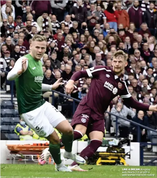  ?? ?? LIKE A DREAM: Kingsley puts Hearts 2-0 up with a well-worked free-kick routine