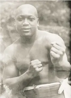 ?? — AFP photo ?? File photo shows boxer Jack Johnson , the first black heavyweigh­t boxing champion, who was sent to prison a century ago in a racially charged case, and was posthumous­ly pardoned by US President Donald Trump.