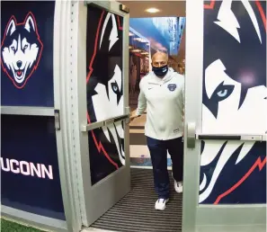  ?? Christian Abraham / Hearst Connecticu­t Media ?? UConn Athletic Director David Benedict, who was hired nearly five years ago, enters the Mark R. Shenkman Training Center on the Storrs campus earlier this month.