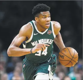  ?? Michael Dwyer / Associated Press ?? Giannis Antetokoun­mpo and the Bucks host the Celtics Wednesday night in Milwaukee with a 3-1 series lead.