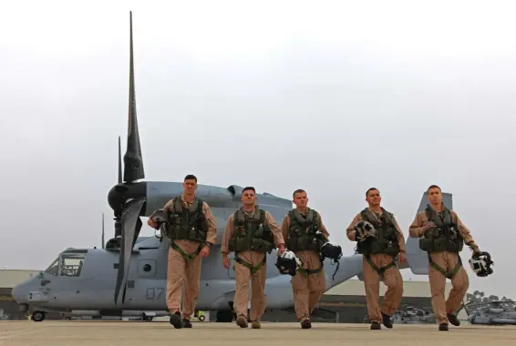  ??  ?? Below: A VMM-161 “Greyhawks” Osprey crew walks the ramp after another mission. Osprey crew numbers vary depending on the particular mission at hand, but it does require a minimum of three.