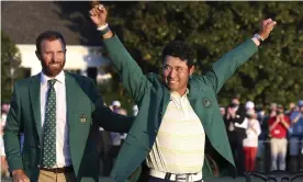  ?? Photograph: Curtis Compton/AP ?? Hideki Matsuyama celebrates in the champion’s Green Jacket at Augusta while the 2020 champion Dustin Johnson (left) looks on.