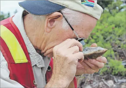  ?? ASHLEY FITZPATRIC­K/THE TELEGRAM ?? Boot and hammer prospectin­g is the way in for most people interested in making the next big mineral discovery, according to experience­d prospector Peter Dimmell. Here, Dimmell has used a hammer-like prospector­s’ tool (you can use a hammer to start out,...