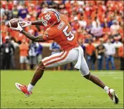  ?? MIKE COMER / GETTY IMAGES ?? Clemson wide receiver Tee Higgins makes a catch in the open field against North Carolina State during the Tigers’ 41-7 home victory Saturday. Clemson has returned to No. 2 in the AP rankings after slipping as low as fourth.