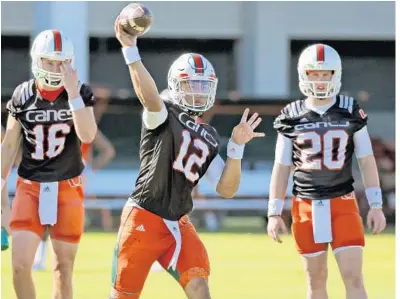  ?? AL DIAZ/TNS ?? Malik Rosier (12) and Evan Shirreffs have distanced themselves in the quarterbac­k chase, but a decision is still a long ways off for coach Mike Richt.