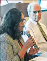  ??  ?? (Left) Kristen Haggins, program officer for the S. Mark Taper Foundation, left; and Tony Newhall, of the Henry Mayo Newhall Foundation, present informatio­n on receiving grants Friday.