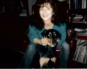  ?? ?? Marcie Fusillo Martini, 32, shown with her dog, Rocky, was murdered in her Walpole townhouse on July 10, 1996.