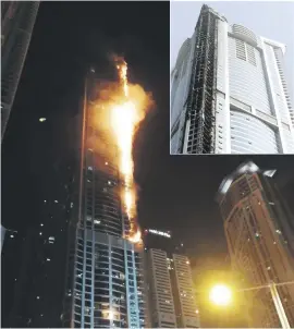  ?? Pictures: Reuters, AFP ?? TOWERING INFERNO. Flames shoot up the sides of The Torch tower in the Marina district, Dubai, yesterday.