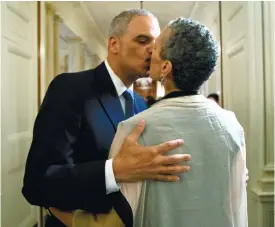  ?? (AP FOTO) ?? FIRST BLACK AG. Attorney General Eric Holder kisses his wife Sharon Malone as they leave the State Dining Room of the White House in Washington, after President Barack Obama announced that Holder is resigning. Holder, who served as the public face of...