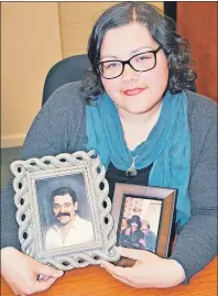  ?? CAROL DUNN/THE NEWS ?? Sara MacKay, who lives in New Glasgow, holds a photo of her father, Mike, and one of her Uncle Tom with Mike — one of the 26 miners killed when the Westray mine exploded.