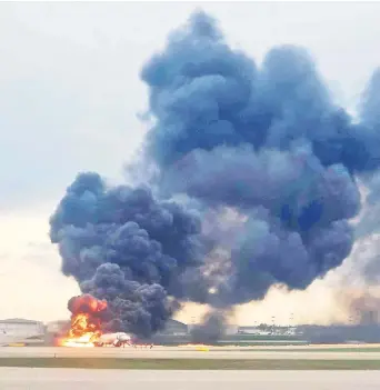  ?? — Reuters photo ?? The Sukhoi Superjet-100 on fire a er an emergency landing at the Sheremetye­vo Airport outside Moscow.