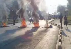  ??  ?? UNZA students burning tyres during a riot