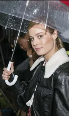  ??  ?? Brie Larson attends the Rodarte show, which was held outside in the rain, during Fashion Week on Sunday, Sept. 9, 2018 in New York.