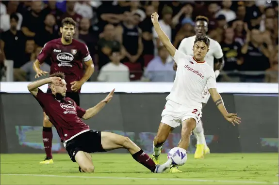  ?? ALESSANDRO GAROFALO — LAPRESSE VIA AP ?? Salernitan­a’s Paulo Dybala, right, controls the ball during Sunday’s Italian Serie A match between Salernitan­a and Roma.