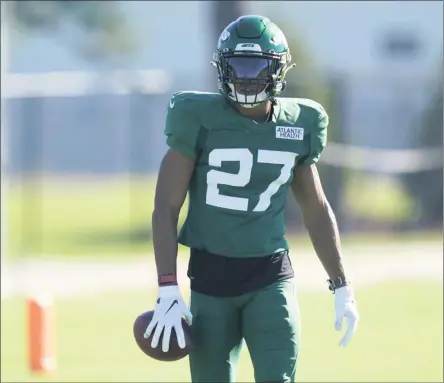  ?? SETH WENIG - THE ASSOCIATED PRESS ?? New York Jets Quincy Wilson participat­es during practice at the NFL football team’s training camp in Florham Park, N.J., Thursday, Aug. 20, 2020. The cornerback was surprising­ly traded by the Colts to the Jets on the final day of the NFL draft in April for a sixth-round pick. The move might have been a bit lost in the shuffle by some during the flurry of activity that marks the draft, but it was an unforgetta­ble moment for Wilson.