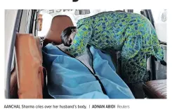  ?? | ADNAN ABIDI Reuters ?? AANCHAL Sharma cries over her husband’s body.