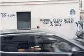  ?? FRANCOIS MORI/AP ?? French graffiti on the right side of a wall last month reads “Duhamel, and the others, you will never be in peace,” referring to claims of sexual abuse.